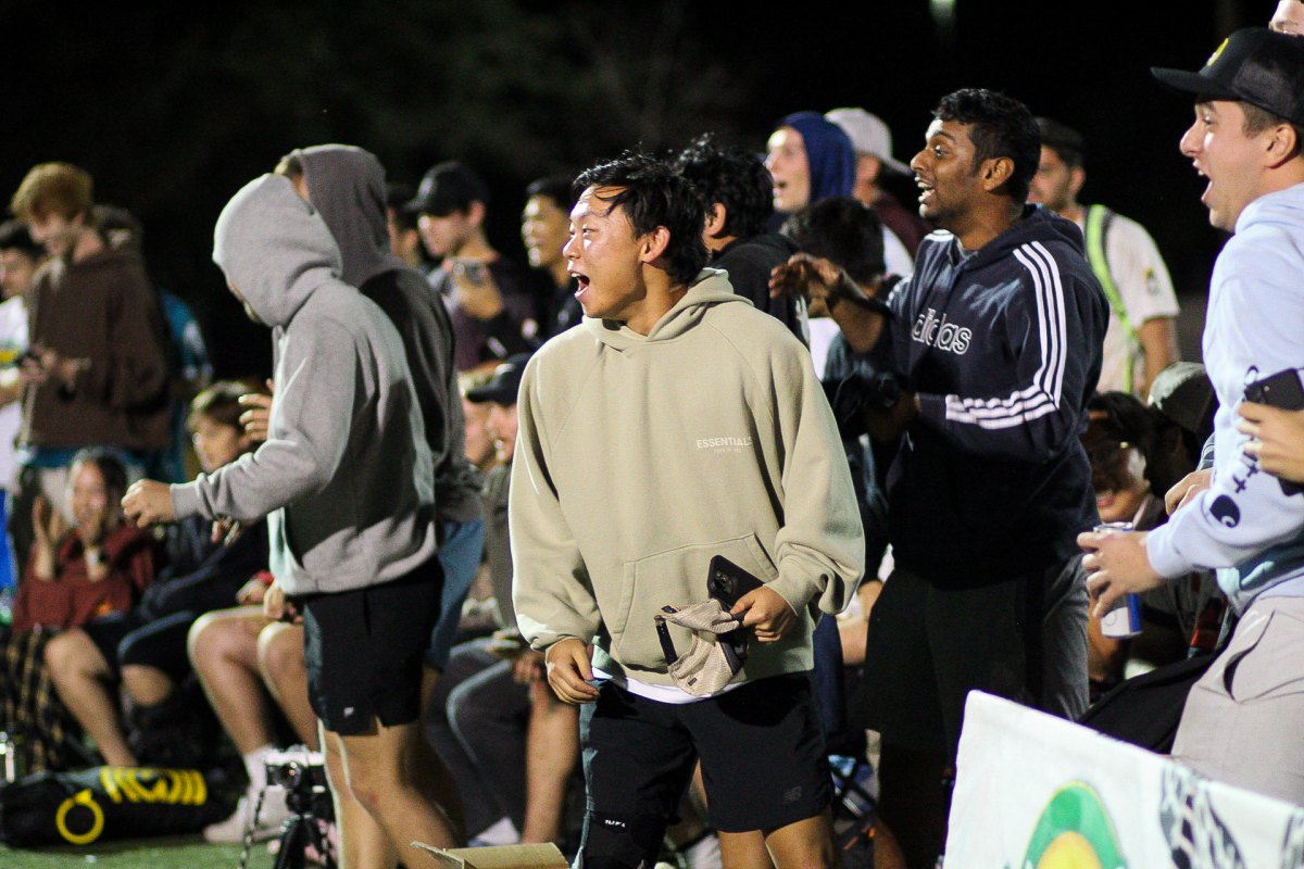 The crowd watching under the lights