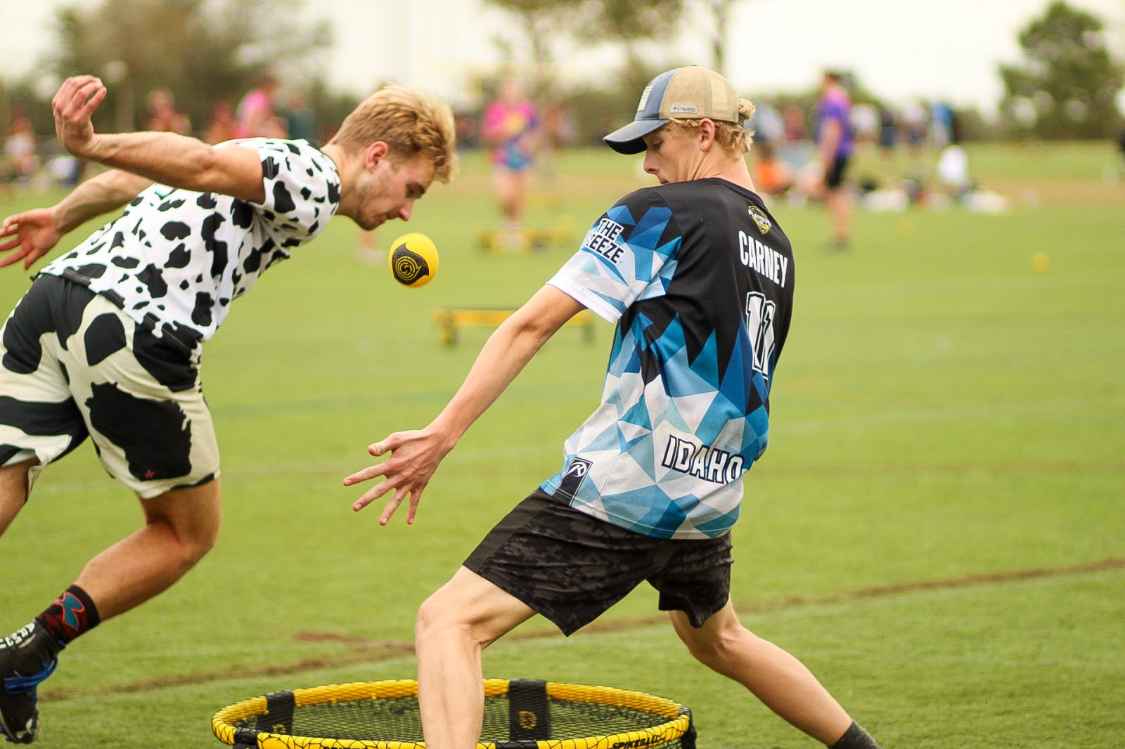 Two players diving for the ball at the net