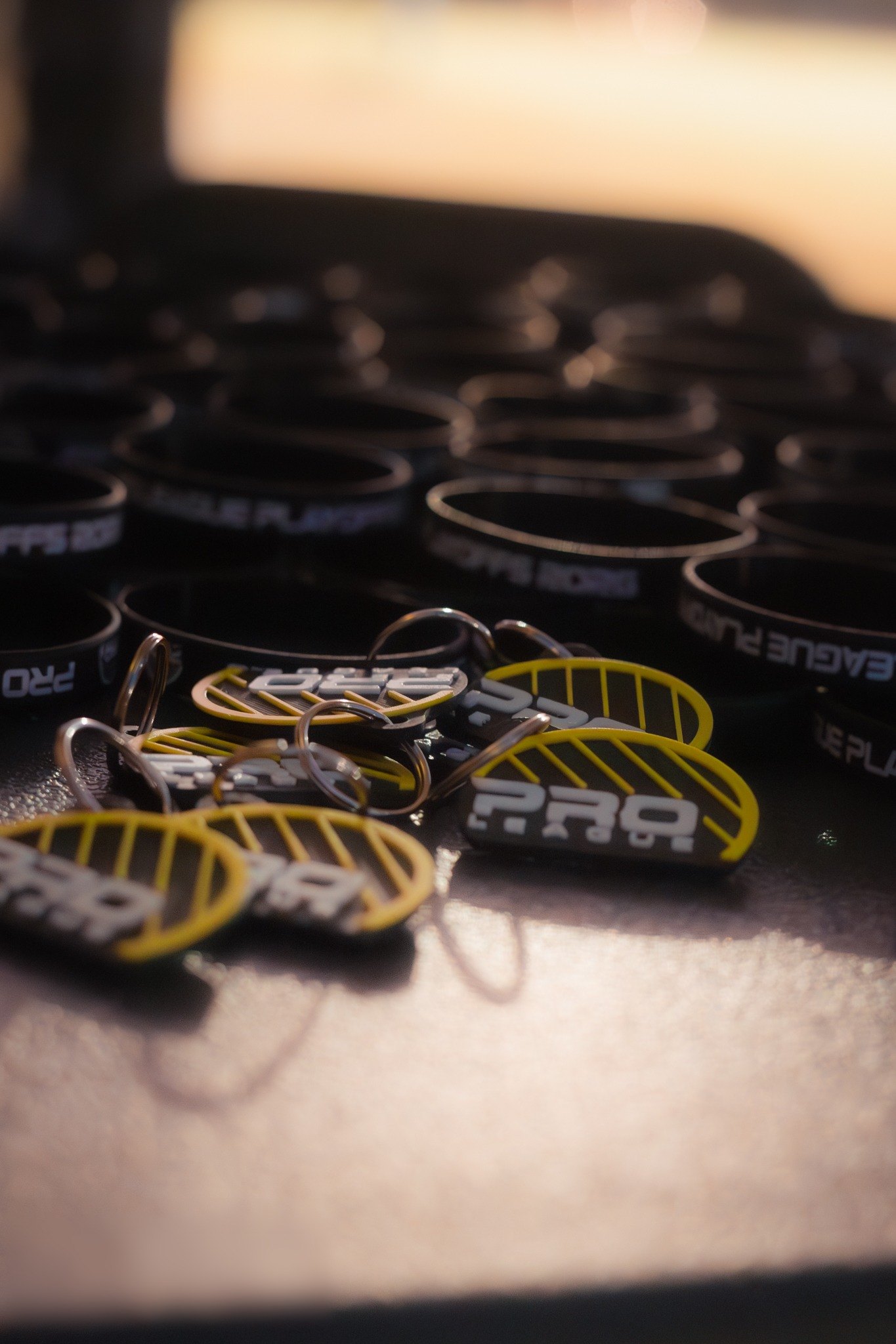 PRO League keychains and wristbands