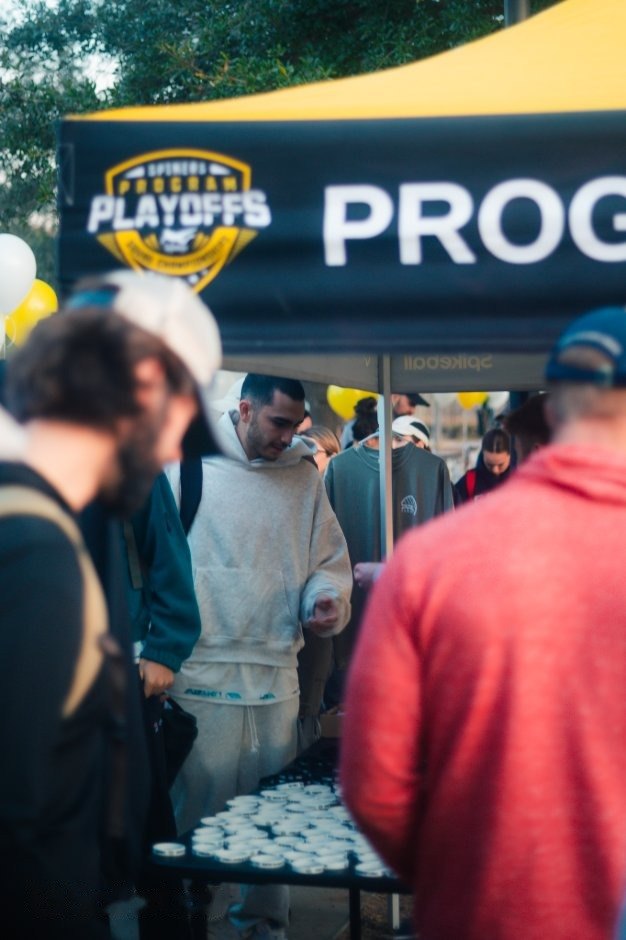 Players checking in under the Playoffs tent